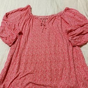 White shirt with pink/red flowers;